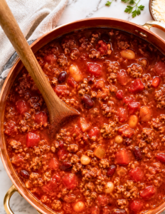 Hearty Italian style chili made with ground beef, Italian sausage, kidney beans, cannellini beans, tomatoes, herbs, and freshly grated Parmesan.