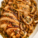Copycat Applebee’s Bourbon Street Chicken with Cajun-seared chicken, sautéed mushrooms, onions and garlic butter sauce.