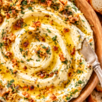 Whipped butter swirled with crispy Thanksgiving herb oil, fried onions, garlic, rosemary, sage, thyme, and black pepper, served with toasted crostini.